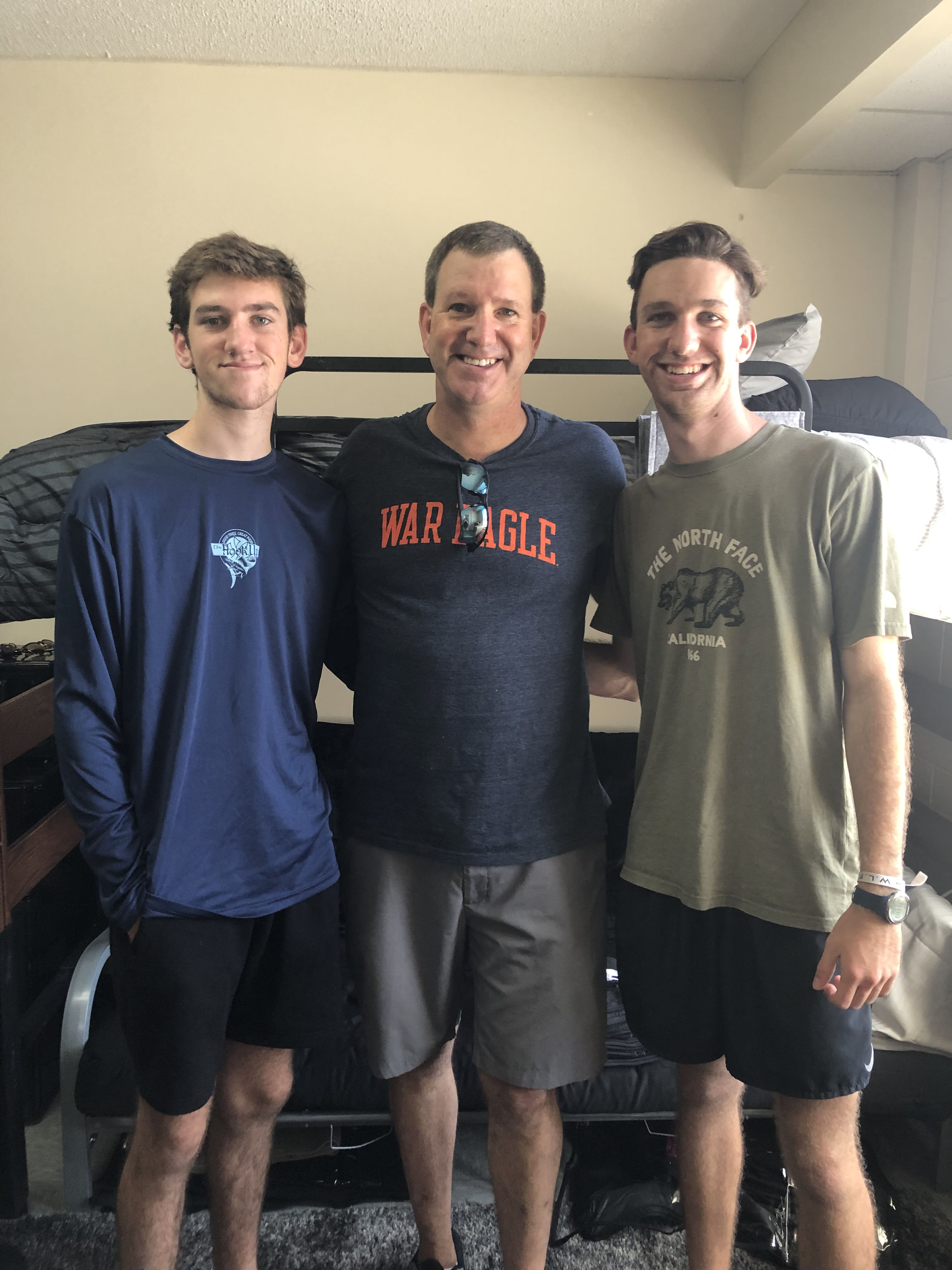 ryan, brendan, and shannon in front of bunk beds