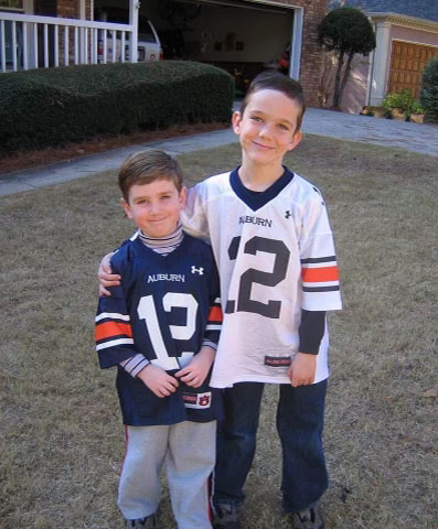 ryan and brendan wearing auburn jersies as young boys